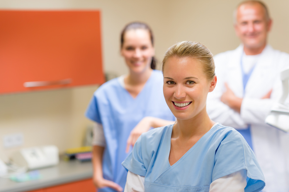 Pediatric dental assistant smiling